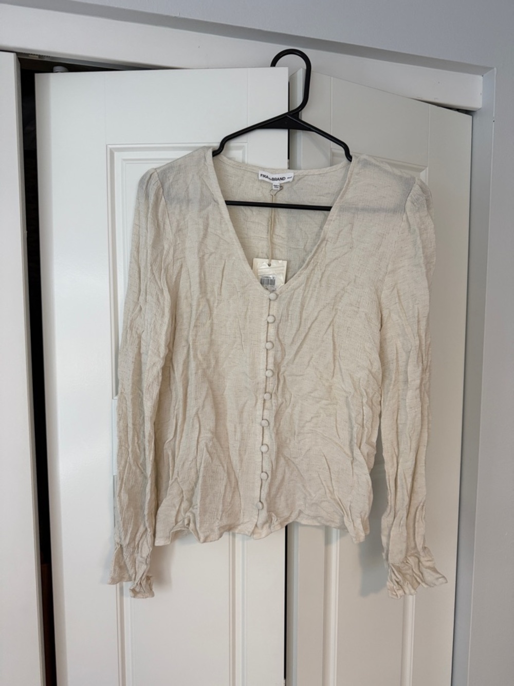 FIKA the brand  Cream V-Neck Button-Front Blouse with Ruffled Cuffs
